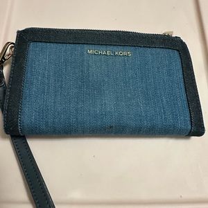 Michael Kors denim wallet. Used condition. Stain on bottom